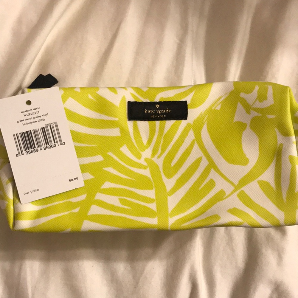 Green and white Kate Spade makeup case